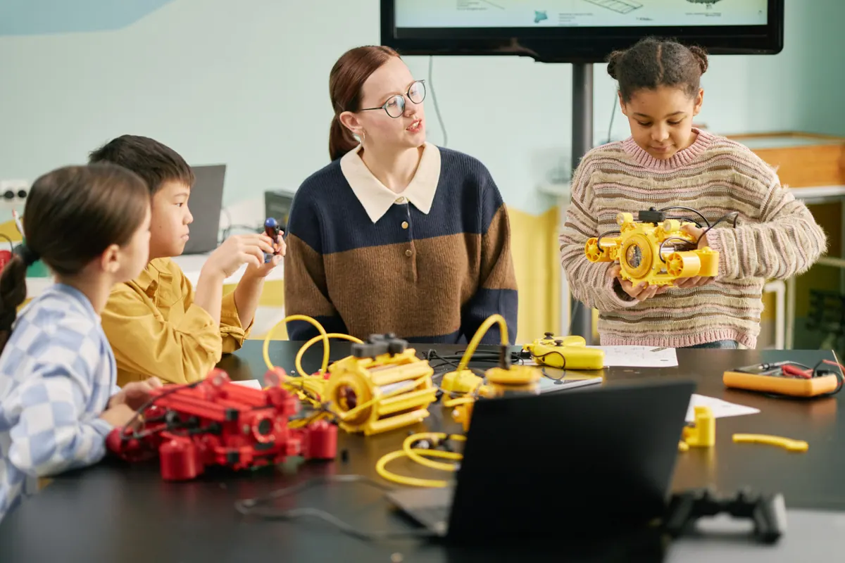 Children building a robot in a STEM workshop