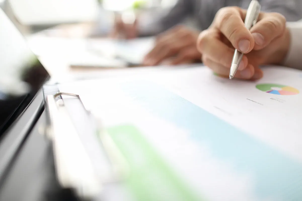 Business plan being reviewed on paper